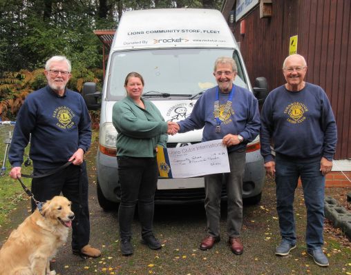 Lions President Chris Seabrook presents a cheque for £2,000 to Nichola Painter - Manager at the Lions Community Store Lions President Chris Seabrook presents a cheque for £2,000 to Nichola Painter - Manager at the Lions Community Store