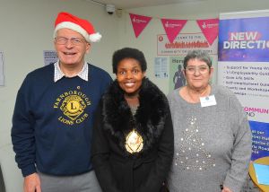 Members of Farnborough & Aldershot Lions Club are pictured talking to the Mayor of RshmoorCouncillor Mara Makunura Members of farnborough & Aldershot Lions Club are pictured talking to the Mayor of RshmoorCouncillor Mara Makunura